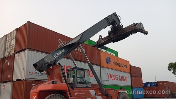 The CARIMEX container yard in Nhon Trach, with containers stacked on the concrete surface