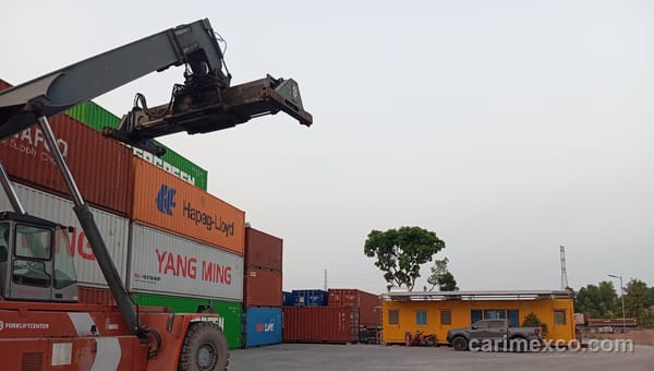 A reach stacker lifting a container at CARIMEX's Nhon Trach yard